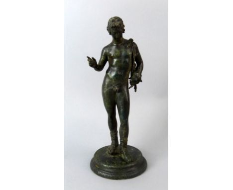 Bronze figure of a man in classical form , on round base 28cm high .   