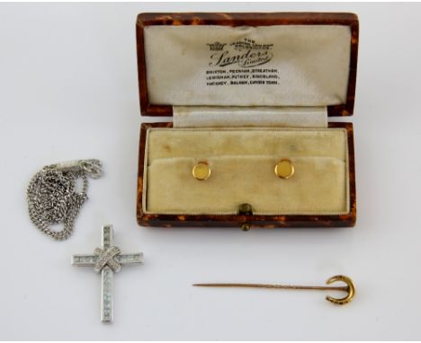 Collection of gold items, horse shoe stick pin stamped 15 ct, diamond and blue topaz cross pendant, measuring approximately 2