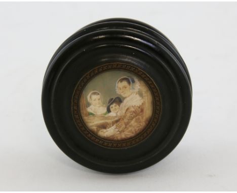 19th Century carved fruitwood box the top inset with family portrait of a Mother and two Children  7 cm diameter .   