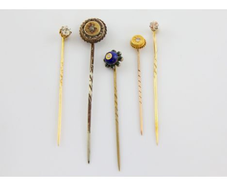 Five stick pins, old cut diamond claw set stick, estimated diamond weight 0.25 carats, three diamond stick pins, white sapphi