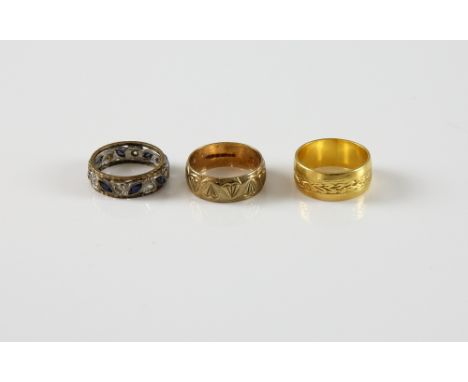 Three rings, vintage patterned gold ring, in 22 ct hallmarked London 1965, size K, decorated heart ring in 9 ct, hallmarked L