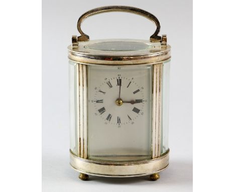 Silver plated and glass oval carriage clock  15 cm 