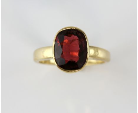 Oval cut Spinel ring, estimated weight 1.73 carats, mounted in 9 ct yellow gold, hallmarked Sheffield 2004, size L.   Gross w