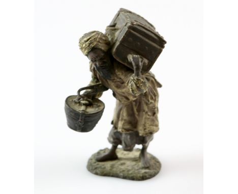 Early 20th century cold painted bronze Arab with suitcase, Austrian, stamped Geschutzt 9cm high .   