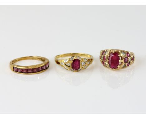 Three rings, oval ruby diamond set shoulders, size W, with a vintage ruby and diamond dress ring, size P,  and a modern garne