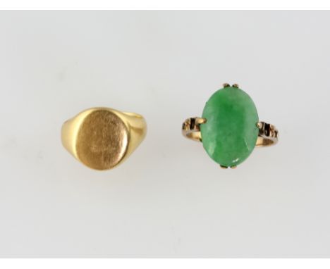 Oval gold signet ring, in 18 ct, size G and a jade ring, oval cabochon cut stone measuring 16 x 10mm, mounted in yellow metal