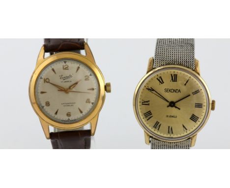 A Soviet era  Sekonda  gentleman's manual wind wristwatch with champagne colour dial ,the yellow metal case mounted on a whit