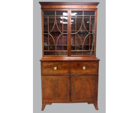 19th century mahogany secretaire bookcase with astragal glazed doors, over a secretaire drawer and cupboards enclosing slides