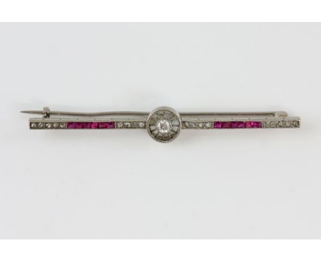 Art Deco ruby and diamond bar brooch, central old cut diamond set in circular border with square cut rubies and rose cut diam