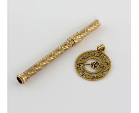 Gold tooth pick in engine turned case, unmarked, and pendant depicting a cannon within ivy leaf border .   weight 4.1 grams 