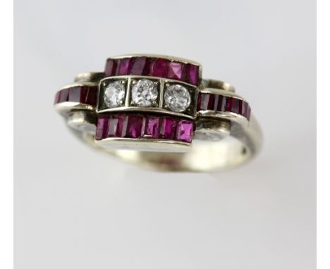 1940's diamond and ruby ring, central panel of three old cut diamonds, estimated total weight 0.30 carats, set with rectangul
