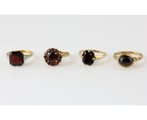 Octagonal step cut garnet single stone ring, estimated weight 5.64 carats, mounted in yellow gold stamped 18 ct, size M, with