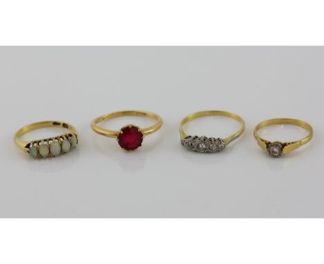 Four gold gem set rings, round brilliant cut diamond single stone ring, size O, an old cut diamond five stone ring, size V, o