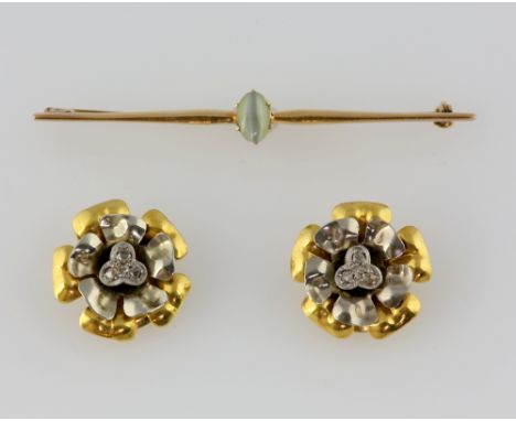 Vintage floral diamond earrings, each earring is set with three Rose cut diamonds, mounted above white and yellow metal flowe