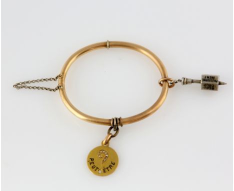 Victorian oval hinged bangle, in rose coloured metal testing as 15 ct with safety chain and hidden clasp, with a French rose 