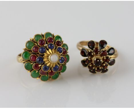 Two vintage rings, with floral settings, one with central round opal, surrounded by a border of sapphires, rubies and emerald