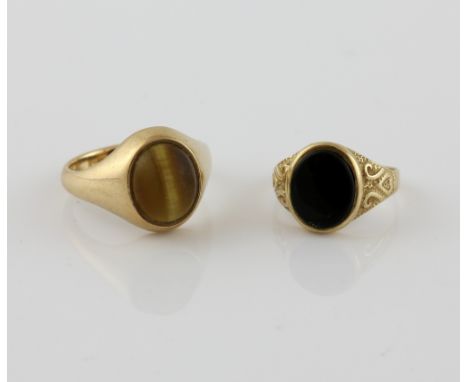 Vintage oval cabochon cut tigers eye signet ring, mounted in 9 ct, size T and onyx signet ring, set in 9 ct, size L.   Gross 