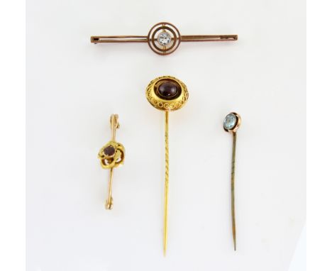 Group of antique jewellery, a foil backed stone stick pin, in yellow metal testing as 15 ct, with wire work border, a red sto