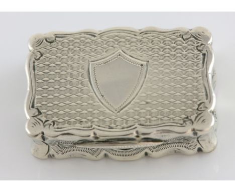 Victorian silver vinaigrette of serpentine form with engine turned decoration, by George Unite, Birmingham, 1889, 18.9g, 3.6c