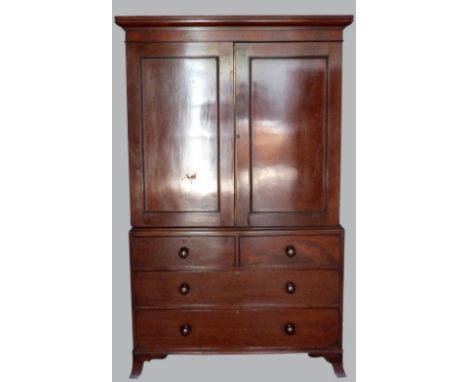 19th century mahogany linen press, with cupboards enclosing slides over two short and two long drawers, on splayed bracket ba