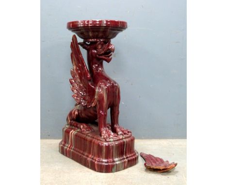 19th century red glazed ceramic pedestal in the form of a Griffin  87cm high .   