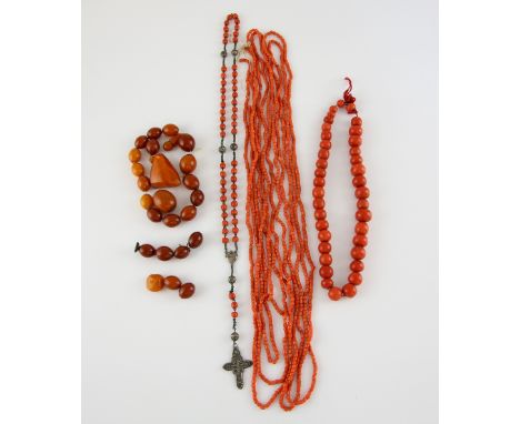 Group of antique coral and amber, one necklace of ovoid beads, largest bead 15 x 10 mm, length 40 cm,  two long necklaces, ea