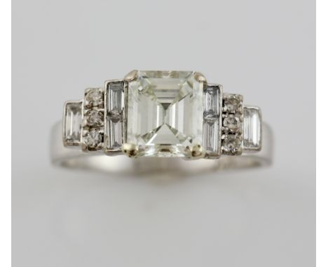 Emerald cut diamond ring,in a raised setting with baguette and brilliant cut diamonds, central stone estimated at  of 1.44 ca