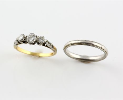 Two rings, old cut diamond three stone ring, estimated total diamond weight 0.60 carat, mounted in yellow metal stamped 18 ct