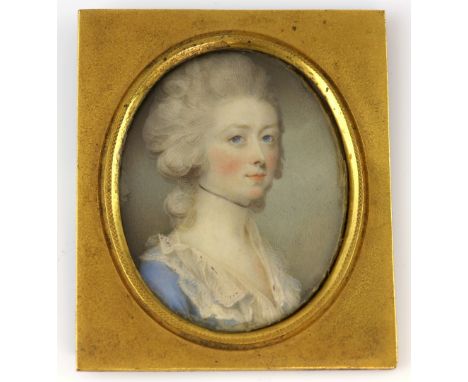 19th century portrait miniature on ivory of a young lady in a blue dress in gilt frame, 5 cm highPLEASE NOTE: THIS ITEM CONTA