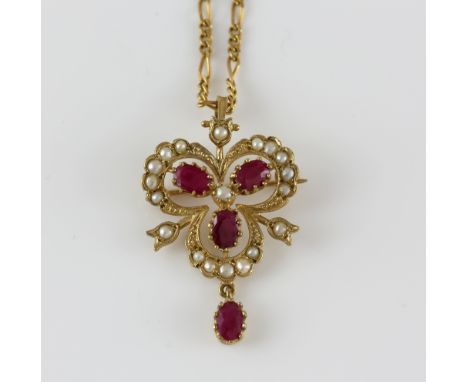 Ruby and seed pearl pendant brooch, four oval cut rubies set in clover motif set with a border of seed pearls, with an articu