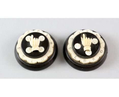 Pair of ebony and ivory games markers,  5 cm diameter,PLEASE NOTE: THIS ITEM CONTAINS OR IS MADE OF IVORY. Buyers must be awa