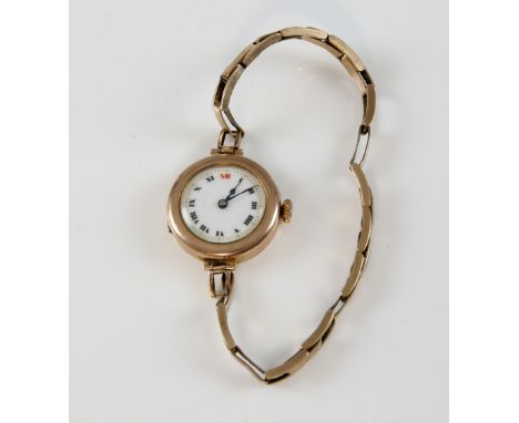 Ladies 9ct gold wristwatch, the circular enamel dial with applied Roman numerals and minute track, fitted with a Swiss mechan