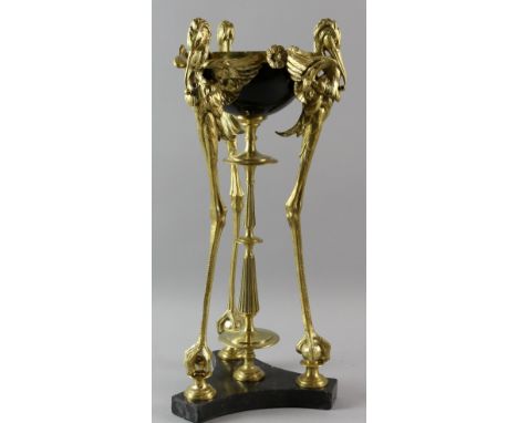 19th/20th century French black enamelled cup on central gilt bronze column and three gilt bronze heron supports and trefoil b