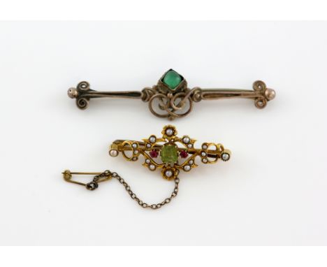 Edwardian brooch set with peridot, ruby, and pearl, mounted in yellow metal stamped 15 ct, measuring approximately 3.8 x 1.7c