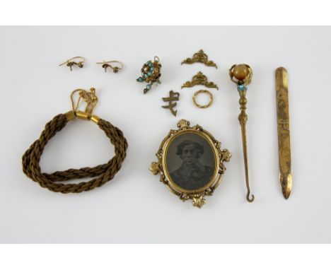 Victorian gilt metal pendant with early photographic portrait of a gentleman, a corded bracelet with engraved clasp, 15 ct go