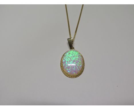 A 9ct yellow gold opal pendant necklace, both hallmarked, total weight approx 5.6 grams, chain 40cm long - ex jewellers stock