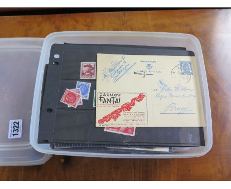 World stamp collection on cards and in packets in a large plastic food container - includes Miniature sheets and First Day co