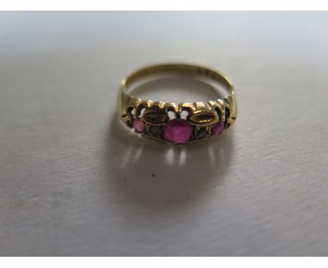 An 18ct yellow gold hallmarked diamond and ruby ring, size M, approx 2.4 grams in clean condition, some abrasions 