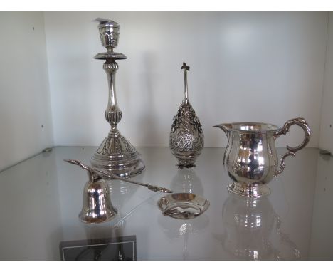 Five pieces of Egyptian silver to include a candlestick - Height 23cm - a water sprinkler, candle snuff, jug and a small dish