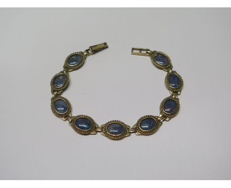 A hallmarked yellow 9ct yellow gold opal bracelet, 19cm long, approx 13.5 grams - in good condition 