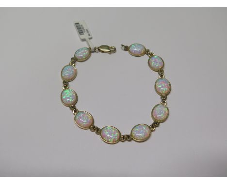 A 9ct yellow gold opal bracelet, 19cm long, approx 7.7 grams, marked 375 - ex jewellers stock, new condition 