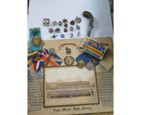 Assorted Militaria and badges, to include two WWI medals to 34873 PT WA RUSTED SUFF R, both names, a Royal Marine light infan