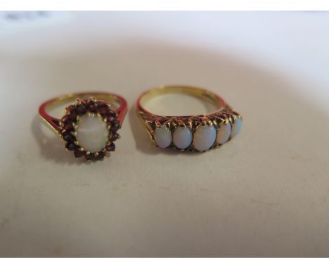 Two 9ct gold opal rings, sizes M and S, total weight approx 7.9 grams, both clean condition with hallmarks 