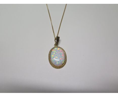 A 9ct yellow gold opal pendant, necklace chain 46cm long, pendant 22mm x 18mm, total weight approx 5 grams, ex jewellers stoc