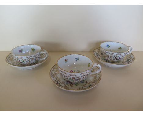 Three Meissen cups and saucers with bird and foliage decoration, saucers 6cm diameter, all generally good some small usage 