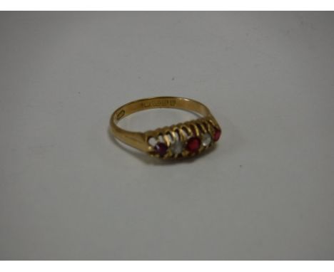 An 18ct gold diamond and ruby ring 