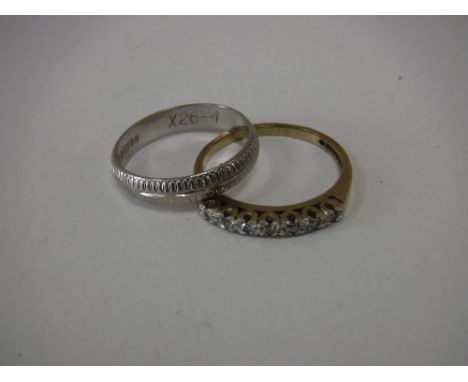 A 9ct white gold wedding band, together with a 9ct gold dress ring 