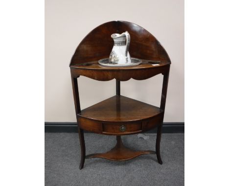 A Georgian mahogany corner washstand together with a china jug and basin