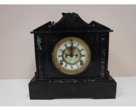 An antique slate mantel clock 