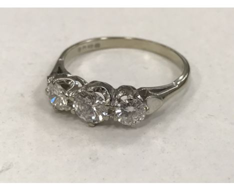 An 18ct gold three stone diamond ring, approximately 1.0 carat